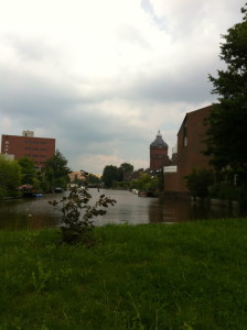 Photo of a canal and a tower-like building.
