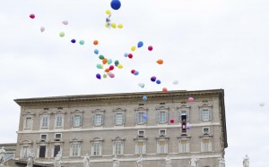 Balloons released from the Pope's studio overlooking St. Peter's Square.